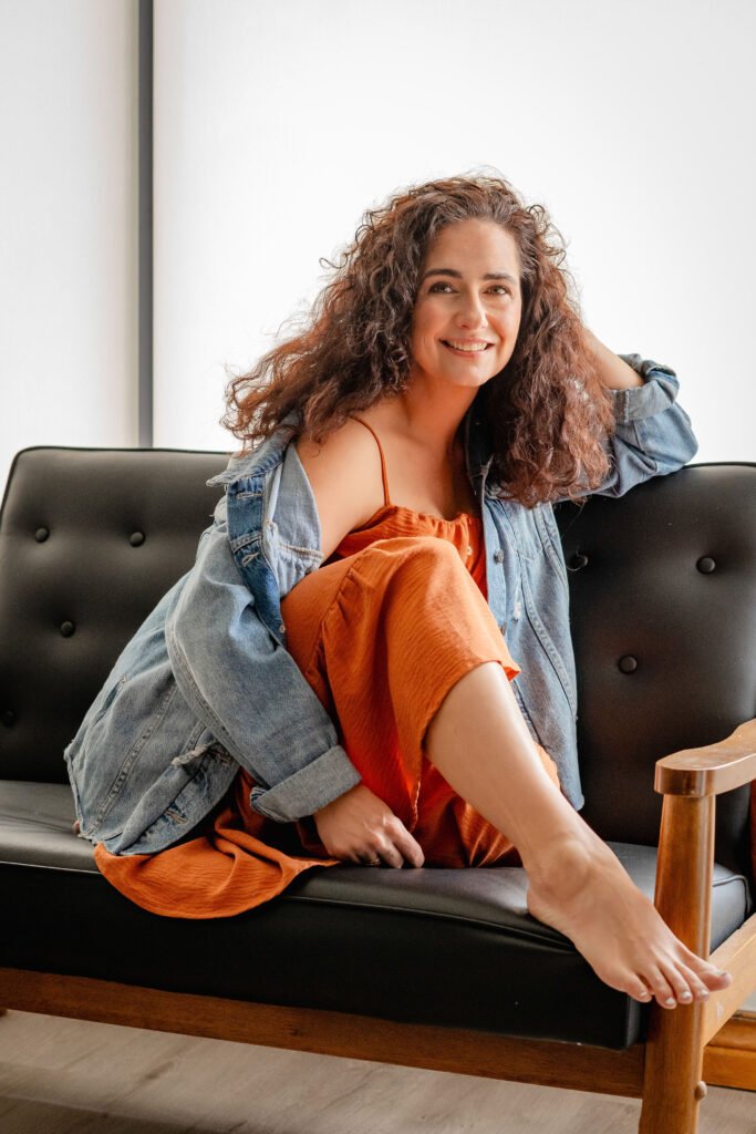 woman smiling on couch